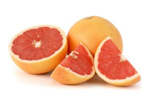 Citrus_paradisi_(Grapefruit,_pink)_white_bg